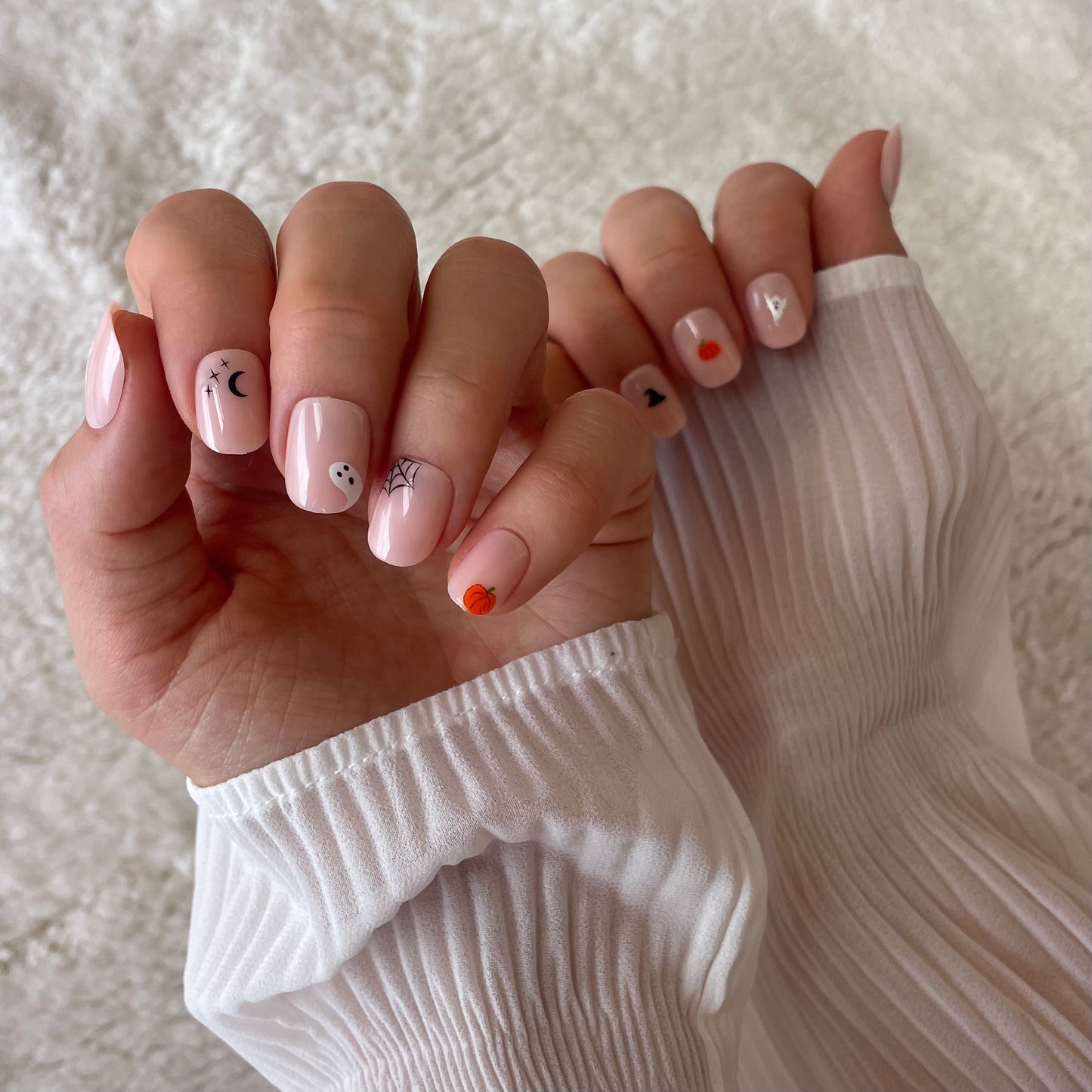 Candy Claws bare minimum extra short fake press-on acrylic nails with spooky Halloween nail art. Easy to remove, non-damaging, reusable.