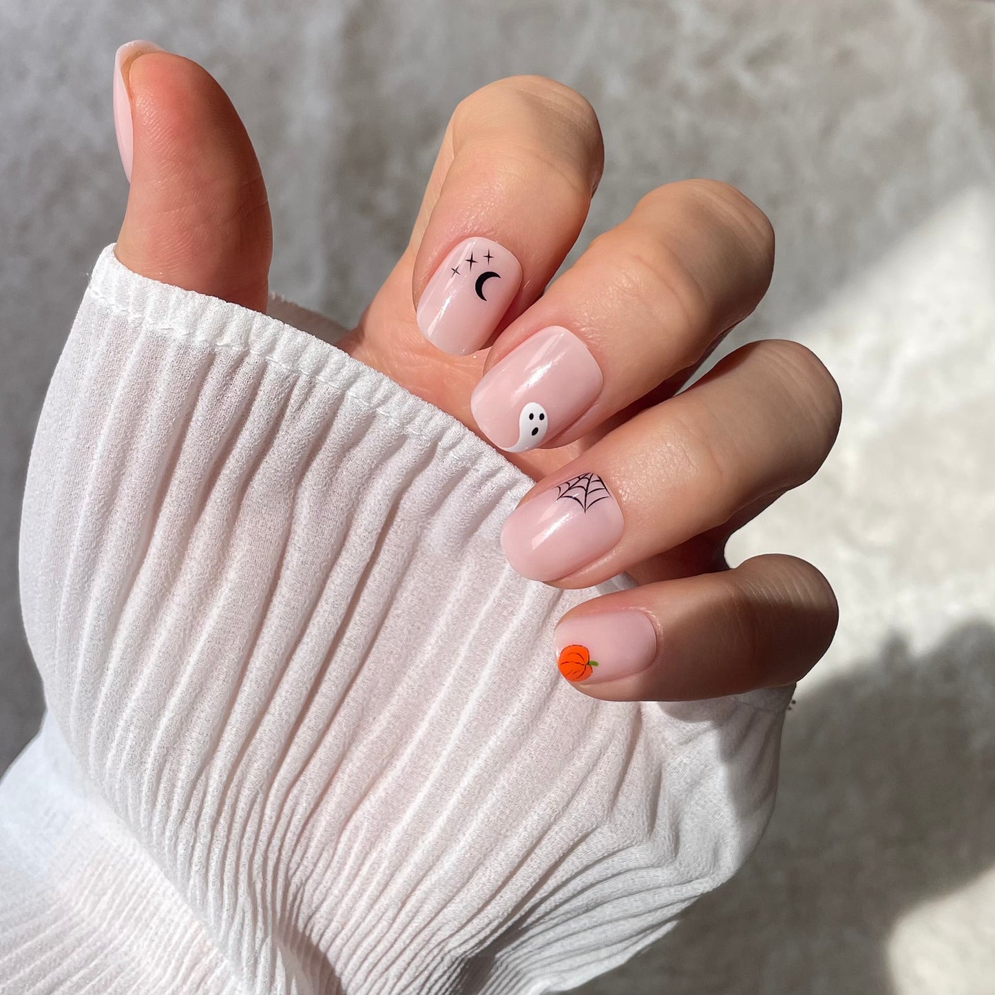 Candy Claws bare minimum extra short fake press-on nails with Halloween nail art for spooky season. Little ghost, spider web, moon & stars.