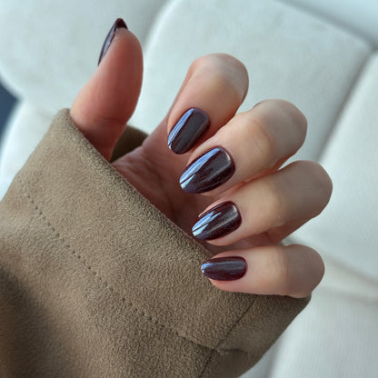 sour grape (short oval) nails reimagined for Halloween with a double cat eye & chrome effect overlaying the deep purple colour