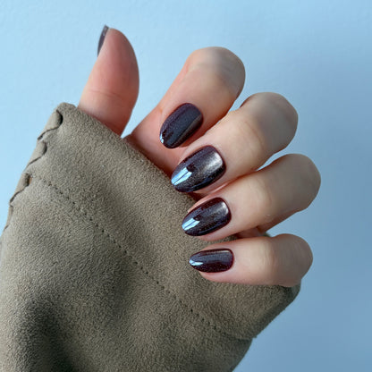 Short oval grapevine press-on nails - deep purple with a double cat eye chrome effect 
